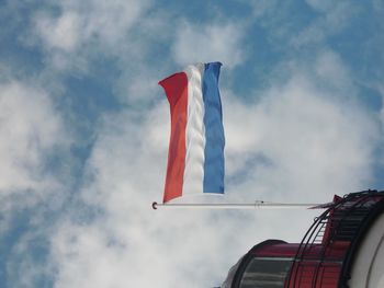 Low angle view of flag against sky