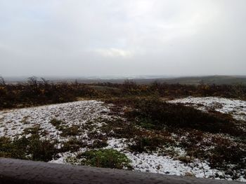 Scenic view of land against sky during winter