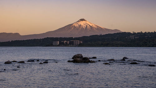 Scenic view of sea against clear sky during sunset