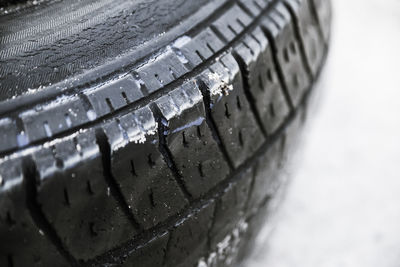 Close-up of tire track in water