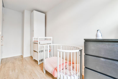 View of crib in room