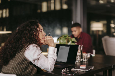 People sitting on table at home