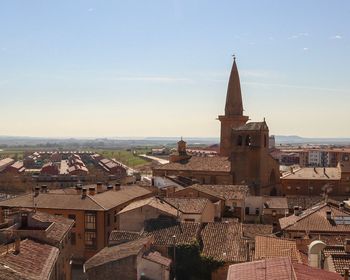 Aerial view of townscape against sky in city