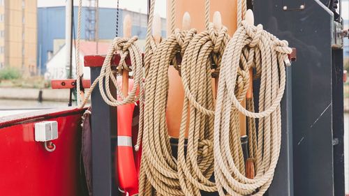 Close-up of tied hanging on rope