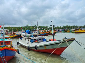 Boats moored at harbor