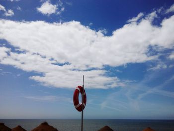 View of heart shape on beach against sky