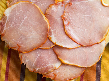 Foreground of sliced loin in a table