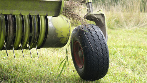 Close-up of wheel and blade or cropper of a agricultural machinery combine harvester. soft focus.