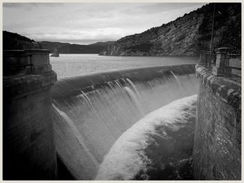 Scenic view of dam against sky