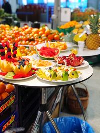 Fruit salad in plates on table