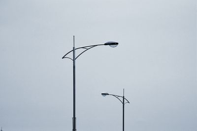 Low angle view of street light against sky