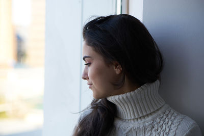 Portrait of young woman looking away