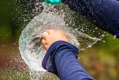 Close-up of boy splashing water