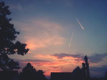 Low angle view of building against cloudy sky