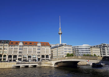 View of buildings against blue sky