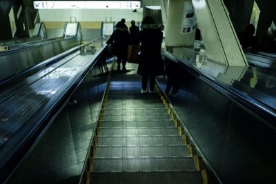 People walking on escalator