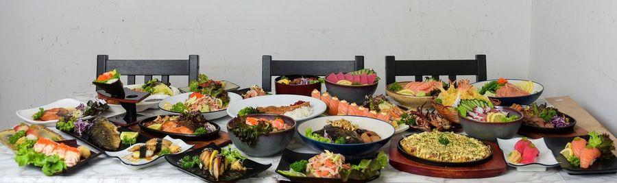 Various food on table against wall