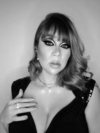 Portrait of woman against wall