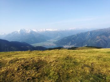 Scenic view of landscape and mountains against sky