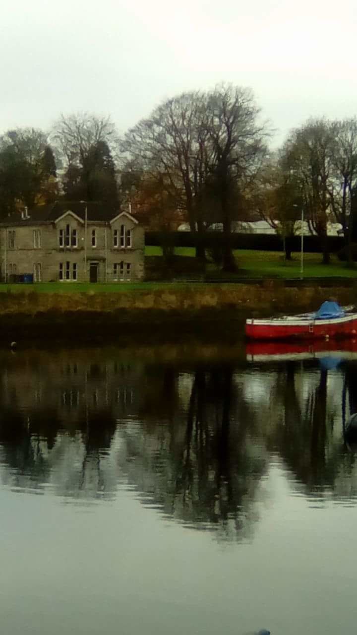 REFLECTION OF BUILDINGS IN WATER