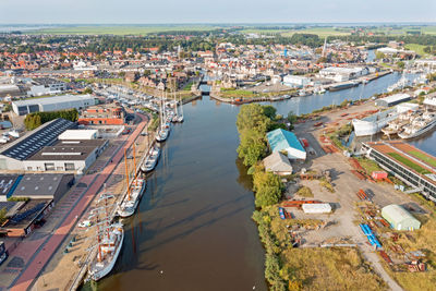 Aerial from the historical city lemmer with traditional sailing boats in friesland  netherlands