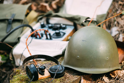 Close-up of old camera on field