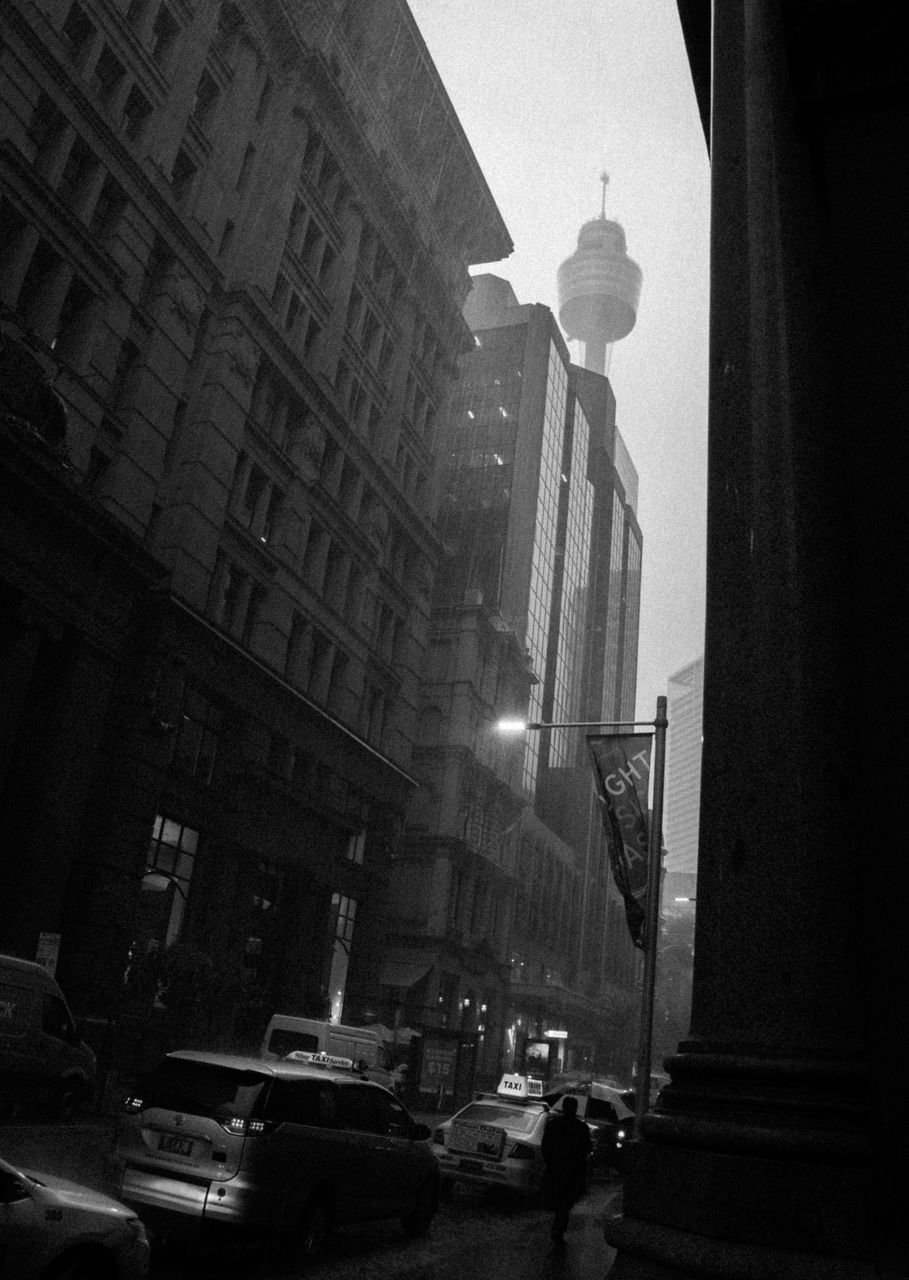 CITY STREET AGAINST SKY AT NIGHT