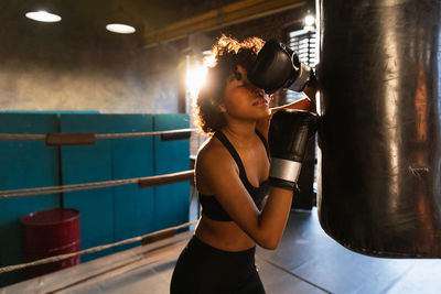 Midsection of woman exercising in gym