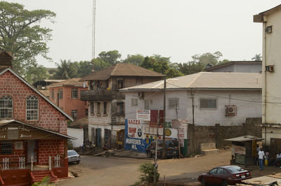 Houses in city against clear sky