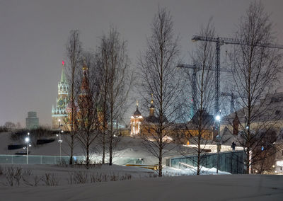 Bare trees against sky during winter