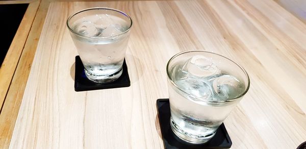 High angle view of ice tea on table