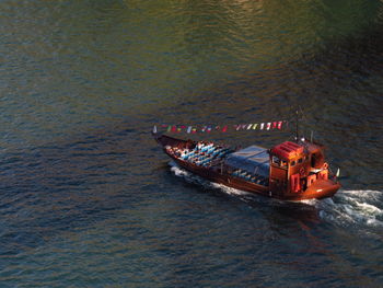 High angle view of boat sailing in sea