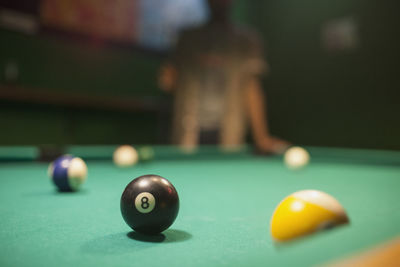 Pool balls on a pool table.