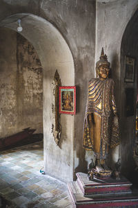 Statue against historic building