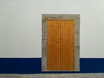 Close-up of open door on wall