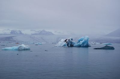 Scenic view of frozen sea against sky