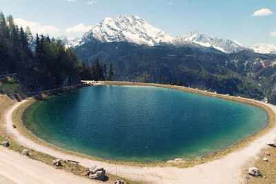 Pond with snowcapped mountain in background