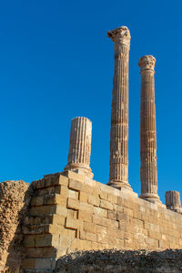 Low angle view of historical building against blue sky