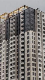 Low angle view of buildings in city against sky