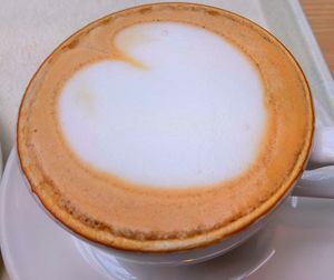 Close-up of cappuccino on table