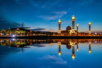 Reflection of illuminated buildings in water at night