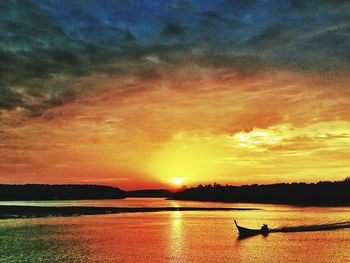 Scenic view of sea at sunset