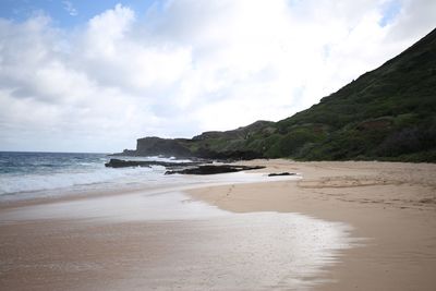 Scenic view of beach against sky