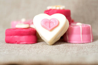 Close-up of heart shape desserts on sack