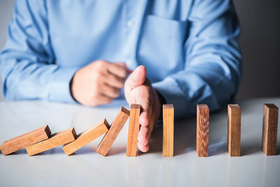 Close-up of man holding table