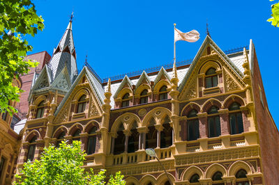 Low angle view of temple building against clear blue sky