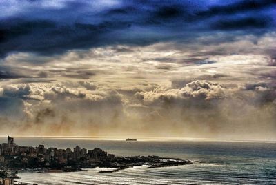 Scenic view of sea against cloudy sky