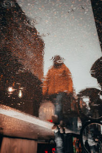 Reflection of building in puddle