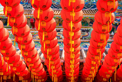 Full frame shot of red lanterns hanging in row