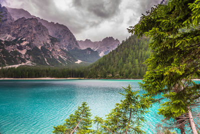 Scenic view of lake and mountains against sky